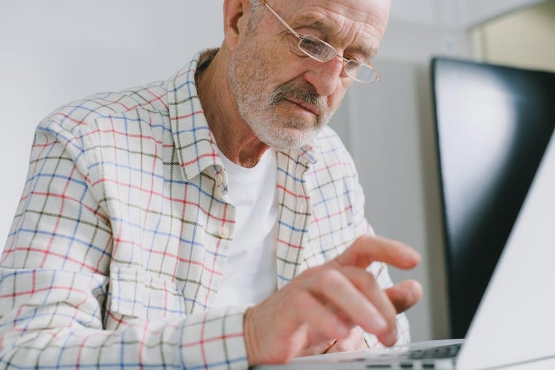 Man typing on a laptop